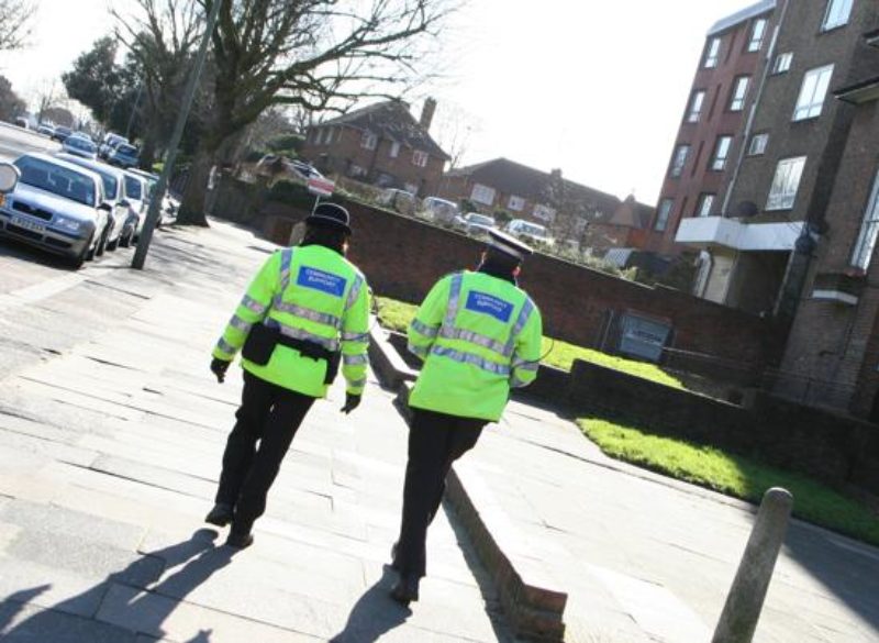 Community Support officers walking through town